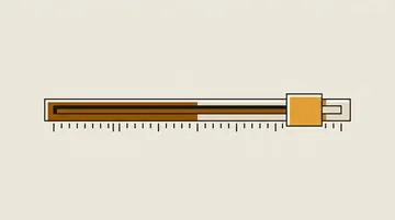 A slider handle against a stop over an unlabelled ruled scale